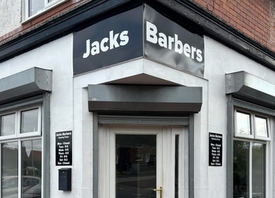 Exterior view of Eden At Jacks Barbers in Clipstone, England, GB. Barbershop signage above the entrance.