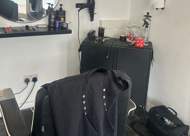 Barber station at Eden At Jacks Barbers in Clipstone, England, GB featuring grooming tools and accessories.