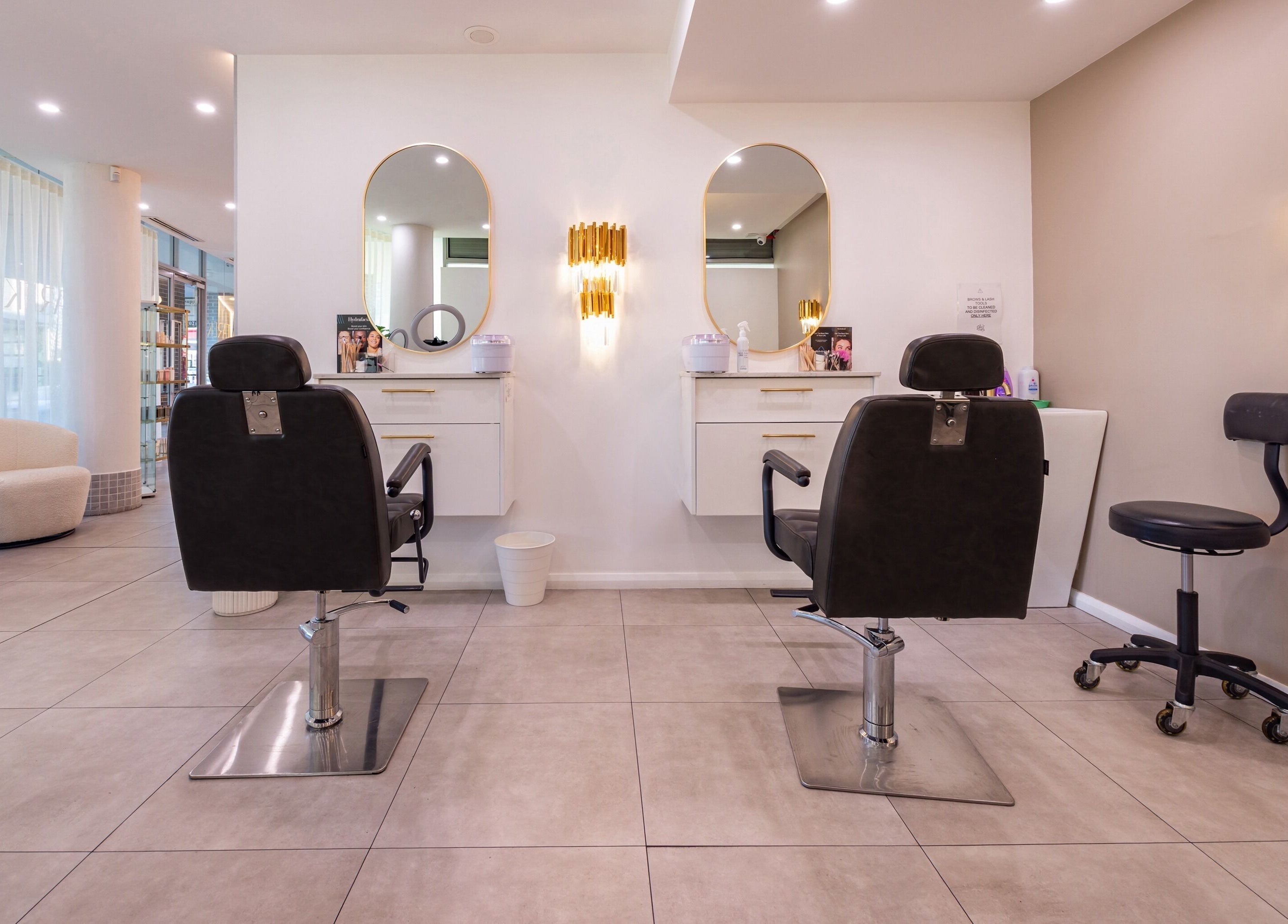 Lana Tarek Eyebrow Specialists in Ashfield, NSW, AU features elegant styling chairs and modern decor.