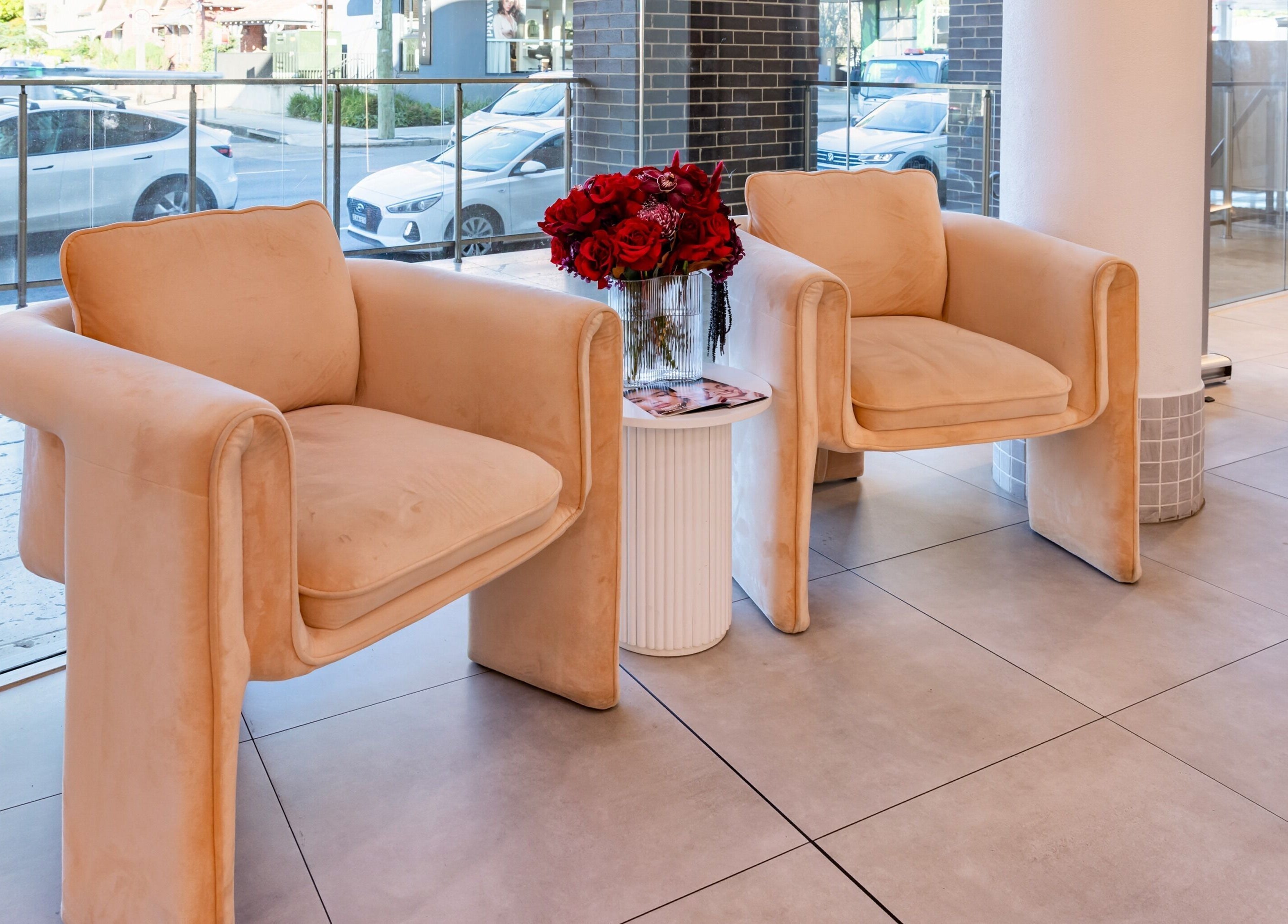 Plush chairs and floral decor at Lana Tarek Eyebrow Specialists, Ashfield, New South Wales, AU.