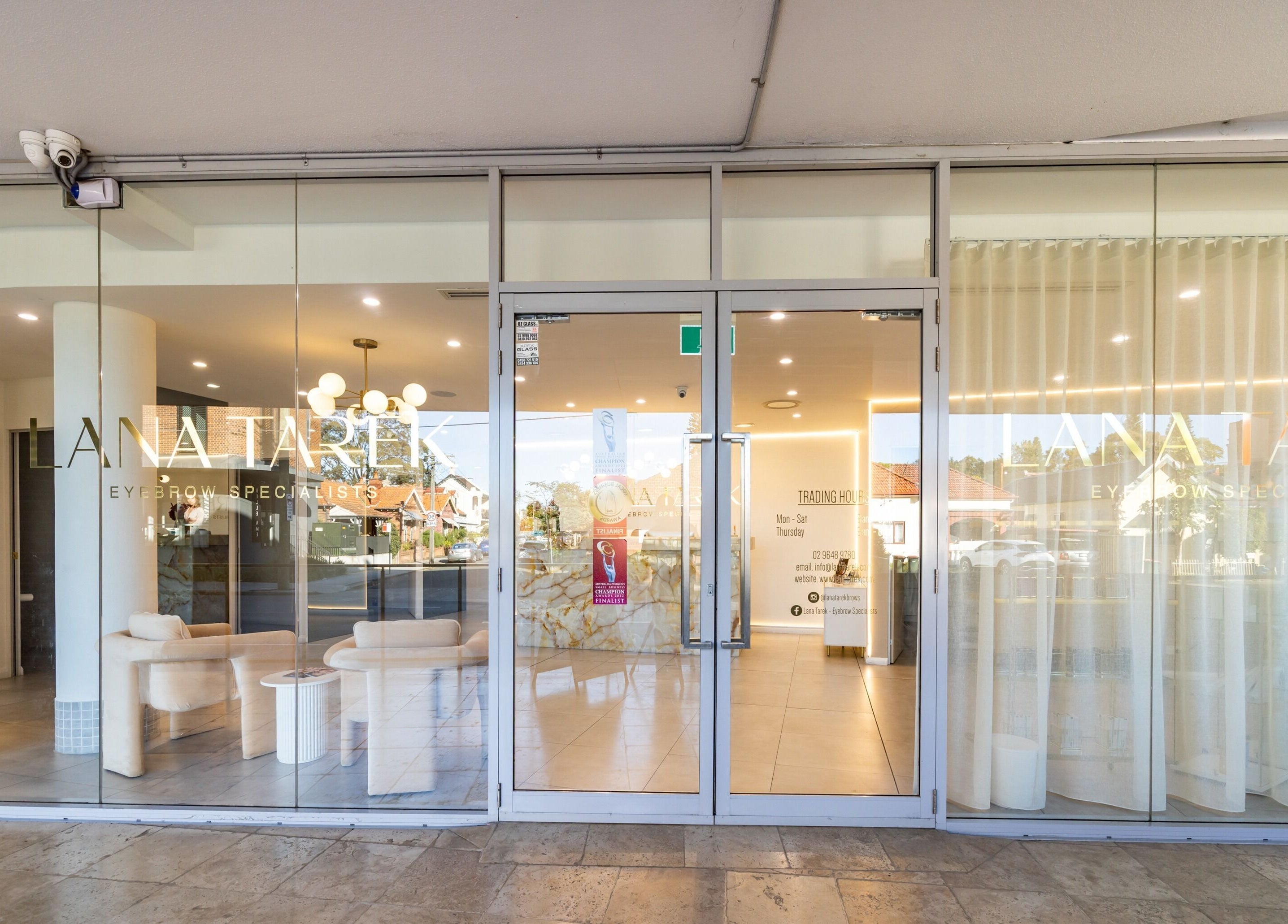 Front view of Lana Tarek Eyebrow Specialists in Ashfield, New South Wales, AU with stylish glass doors.
