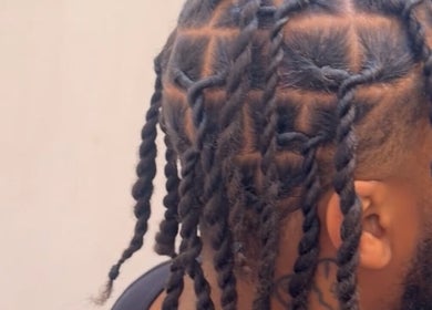 Intricate hair twists at HairbyQ in London, England, GB, showcasing expert styling for textured hair.