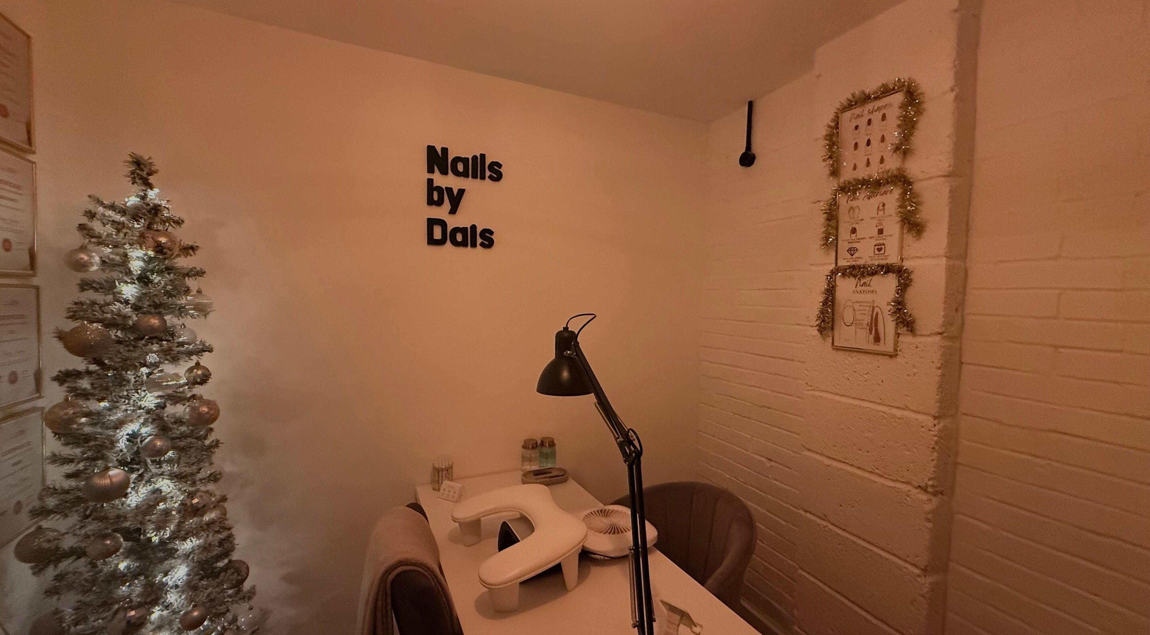 Cozy nail station at By Daisy James, Market Weighton, England, GB, featuring a mini decorated tree.