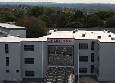 Exterior view of E-Medcentre near Meltonian Mzimba Psychologist in Randburg, Gauteng, ZA with lush greenery.