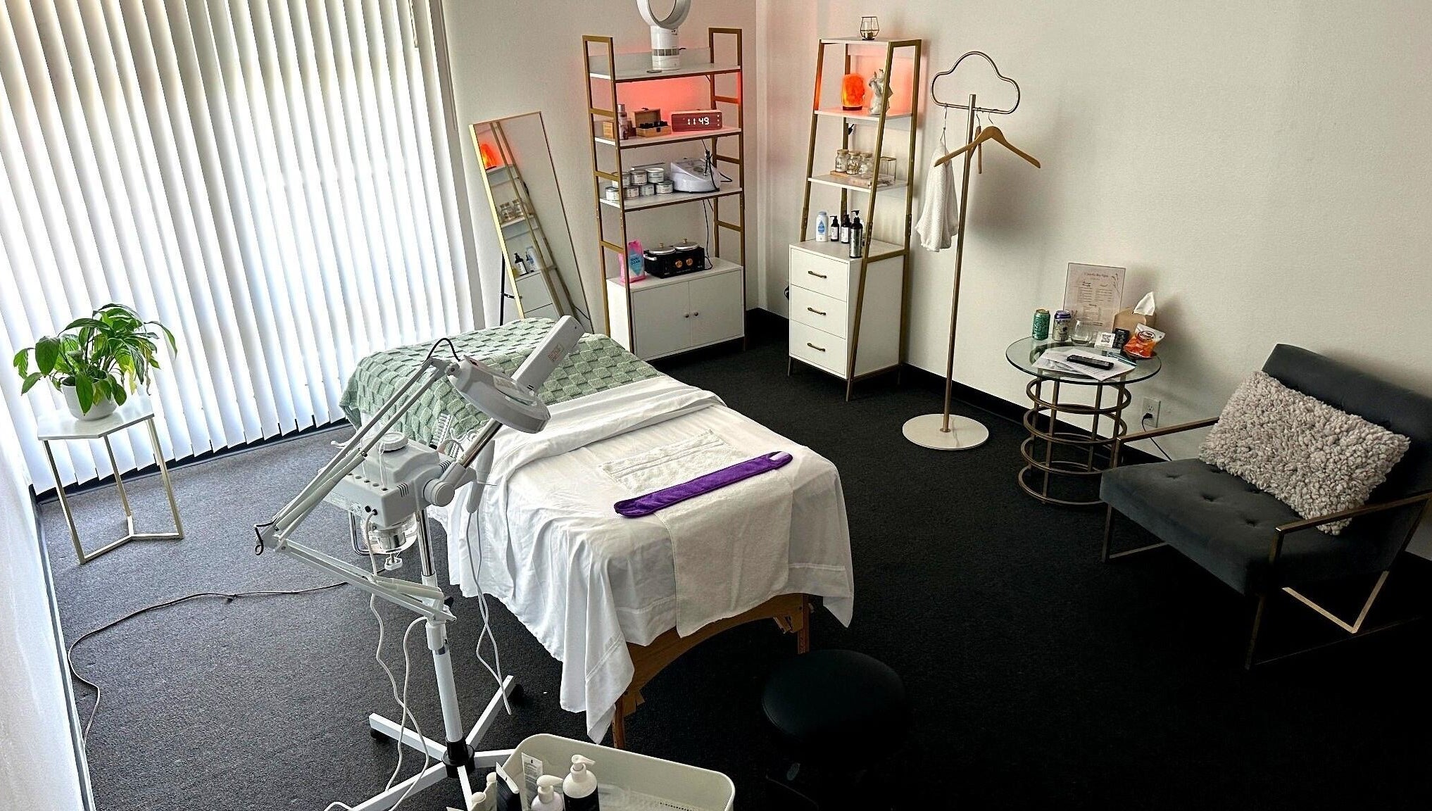 A tranquil treatment room at Lash & Glow by Oana in Newport Beach, California, US, featuring a cozy bed.