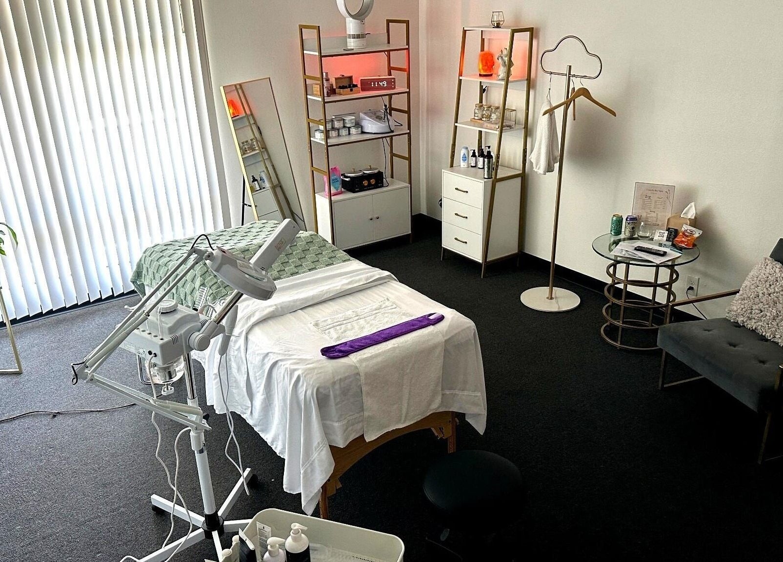 A tranquil treatment room at Lash & Glow by Oana in Newport Beach, California, US, featuring a cozy bed.