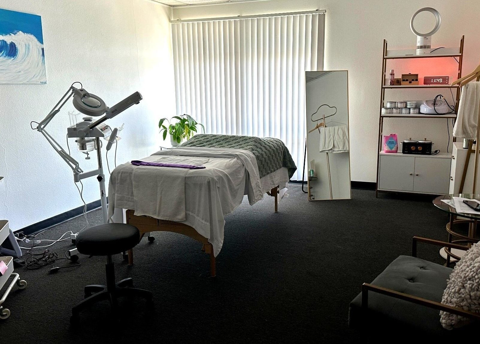 Lash & Glow by Oana's tranquil treatment room in Newport Beach, California, US, featuring modern equipment.