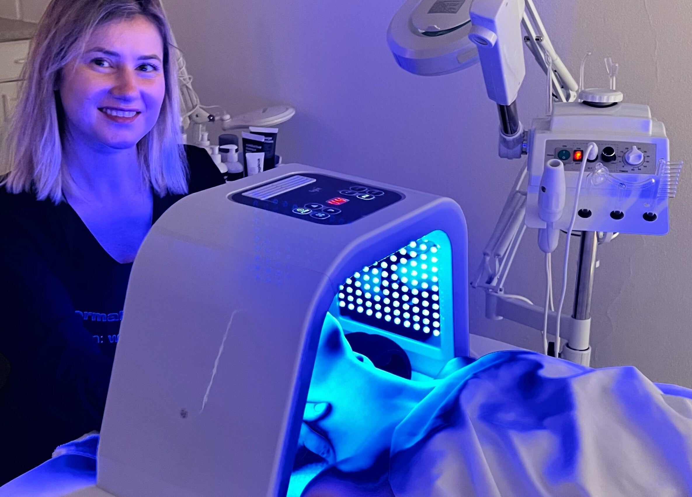 Woman enjoying LED therapy at Lash & Glow by Oana, Newport Beach, California, US.