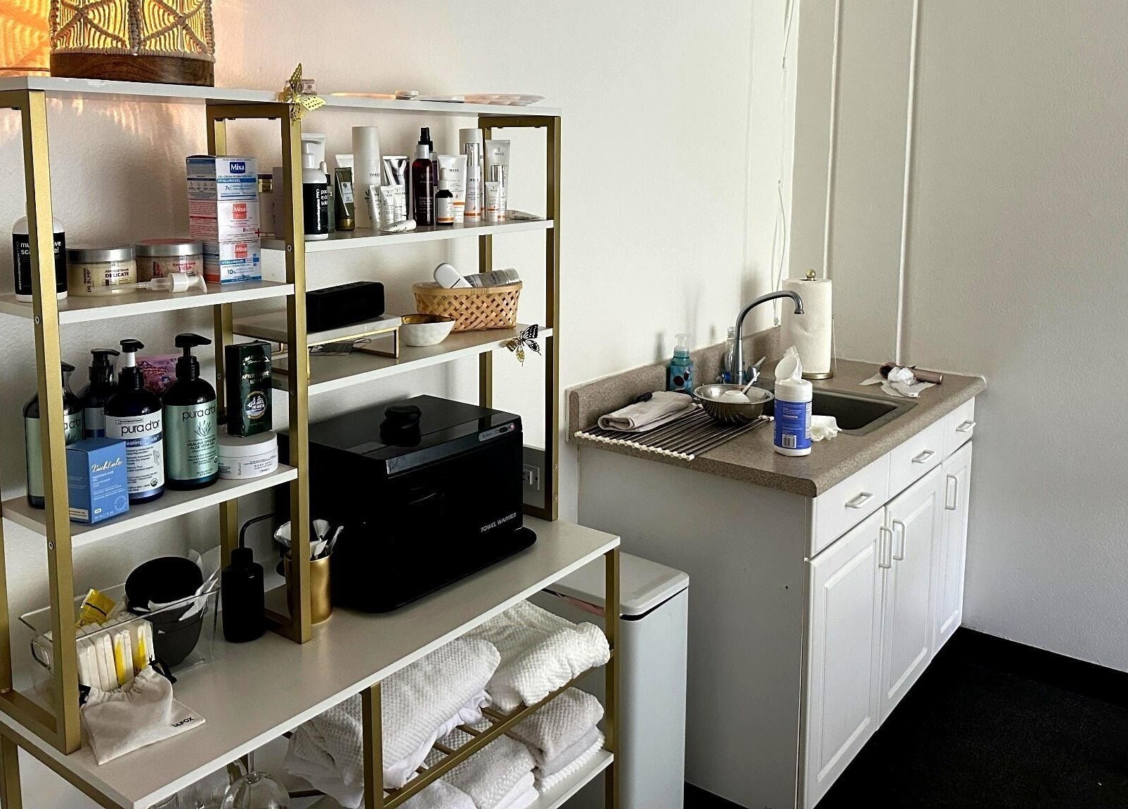 Well-organized beauty products on shelves at Lash & Glow by Oana, Newport Beach, California, US.