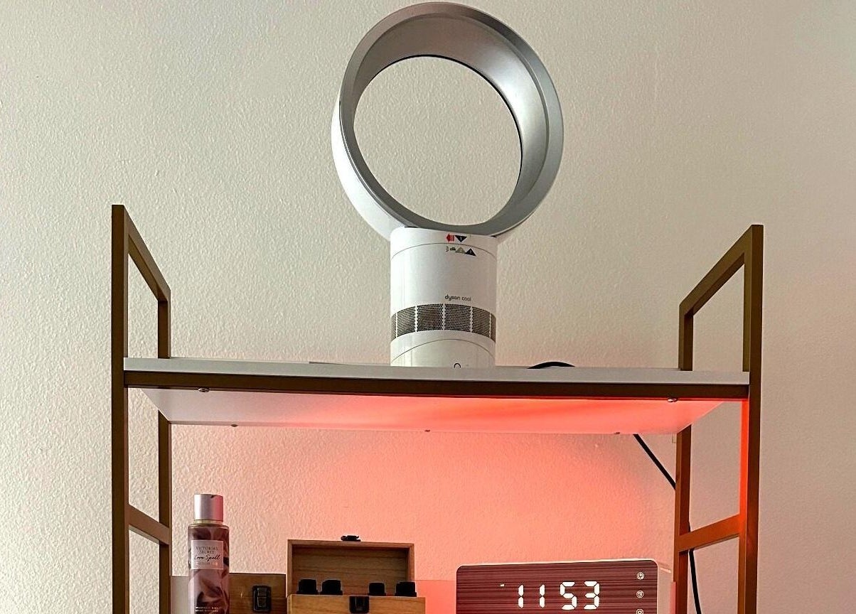 Stylish shelf with fan and clock at Lash & Glow by Oana in Newport Beach, California, US.