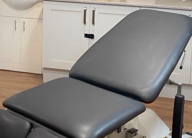 Comfortable treatment bed in Prism Aesthetics & Wellness, London, England, GB.