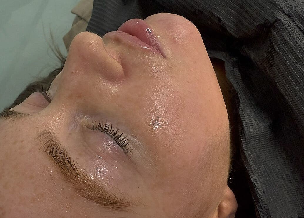 Relaxed woman post-facial treatment at Eyelash Envy Aesthetics, Barrow-in-Furness, England, GB.