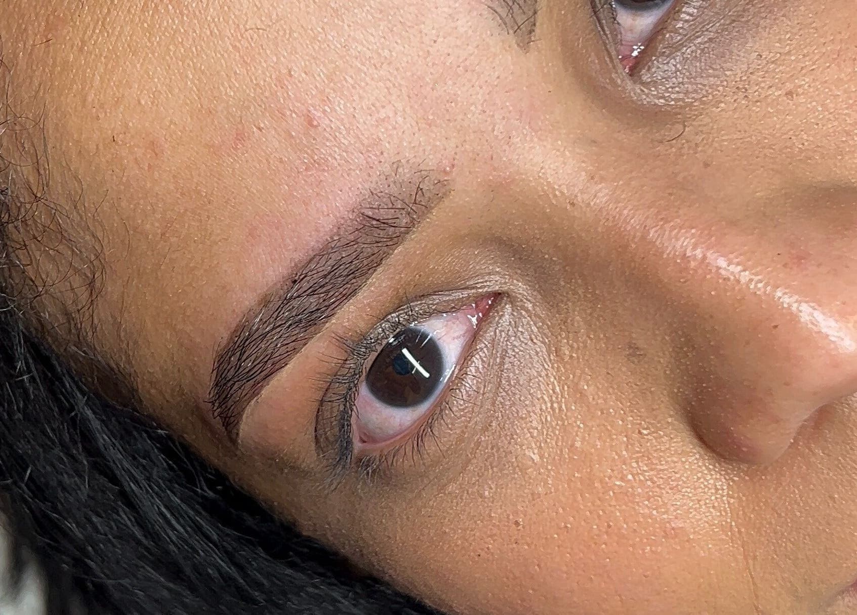 Close-up of expertly shaped eyebrows at Glamar brows studio, London, England, GB.