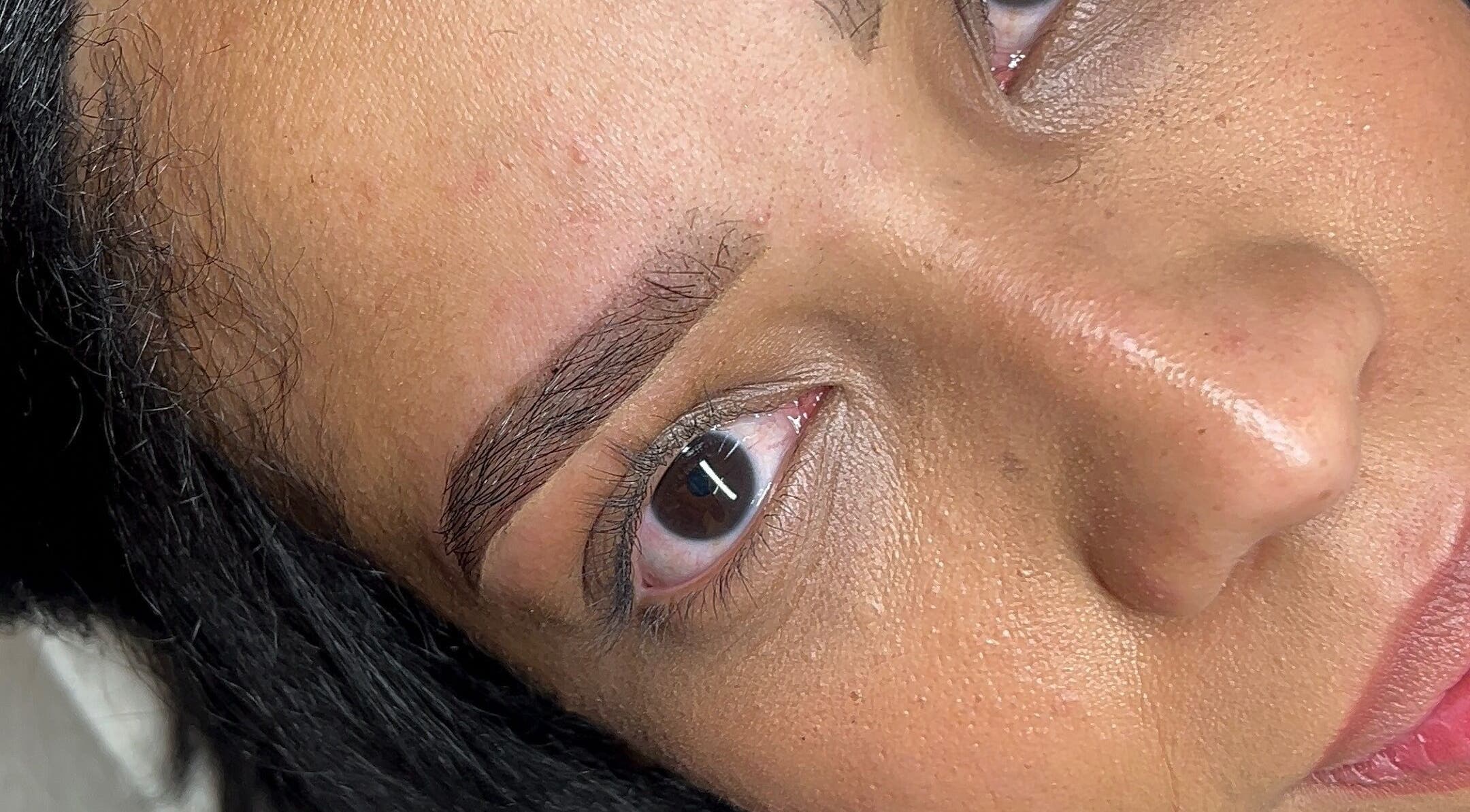 Close-up of expertly shaped eyebrows at Glamar brows studio, London, England, GB.