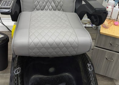 Luxurious pedicure chair at Yocarys hair & latin, Gibsonton, Florida, US captures modern salon elegance.