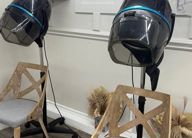 Hair drying chairs at Yocarys Hair & Latin, Gibsonton, Florida, US offering modern beauty services.