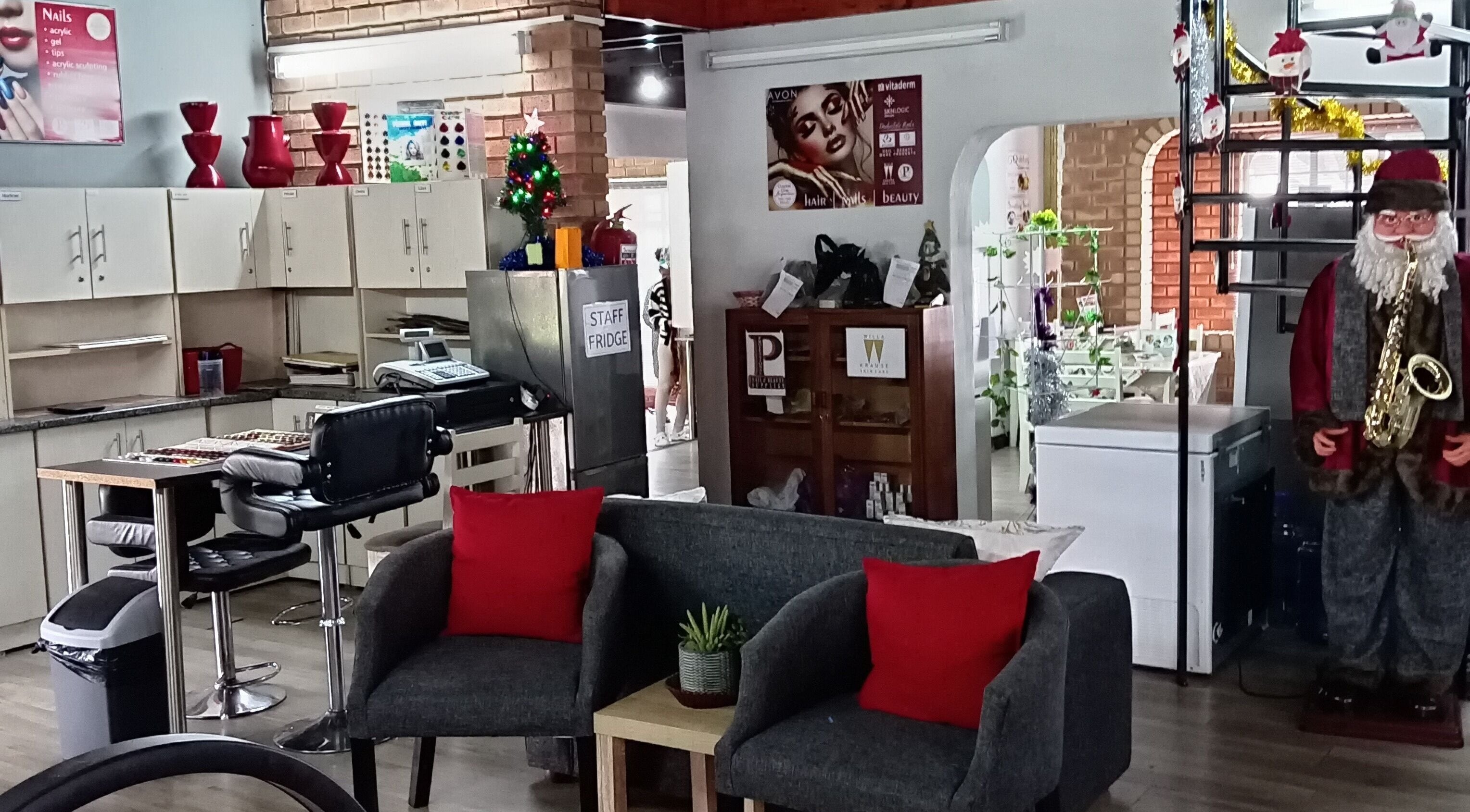 Welcoming interior of Miss Vee Nails and Beauty in Pretoria, Gauteng, ZA, with stylish seating and decor.