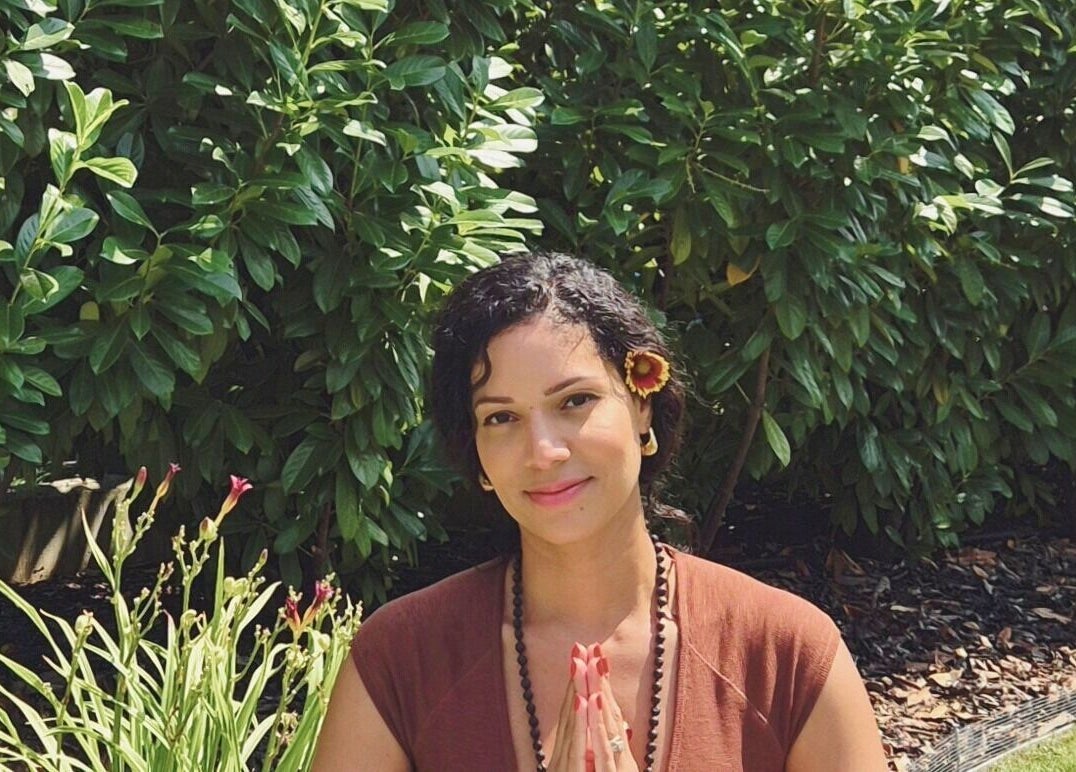 Woman meditating outdoors at Vibeinwards, Ruislip, England, GB.