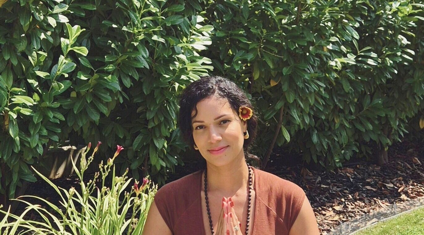 Woman meditating outdoors at Vibeinwards, Ruislip, England, GB.
