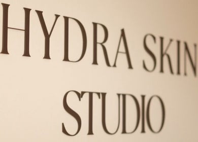HYDRASKIN STUDIO sign on a wall in London, England, GB, showcasing beauty and wellness.