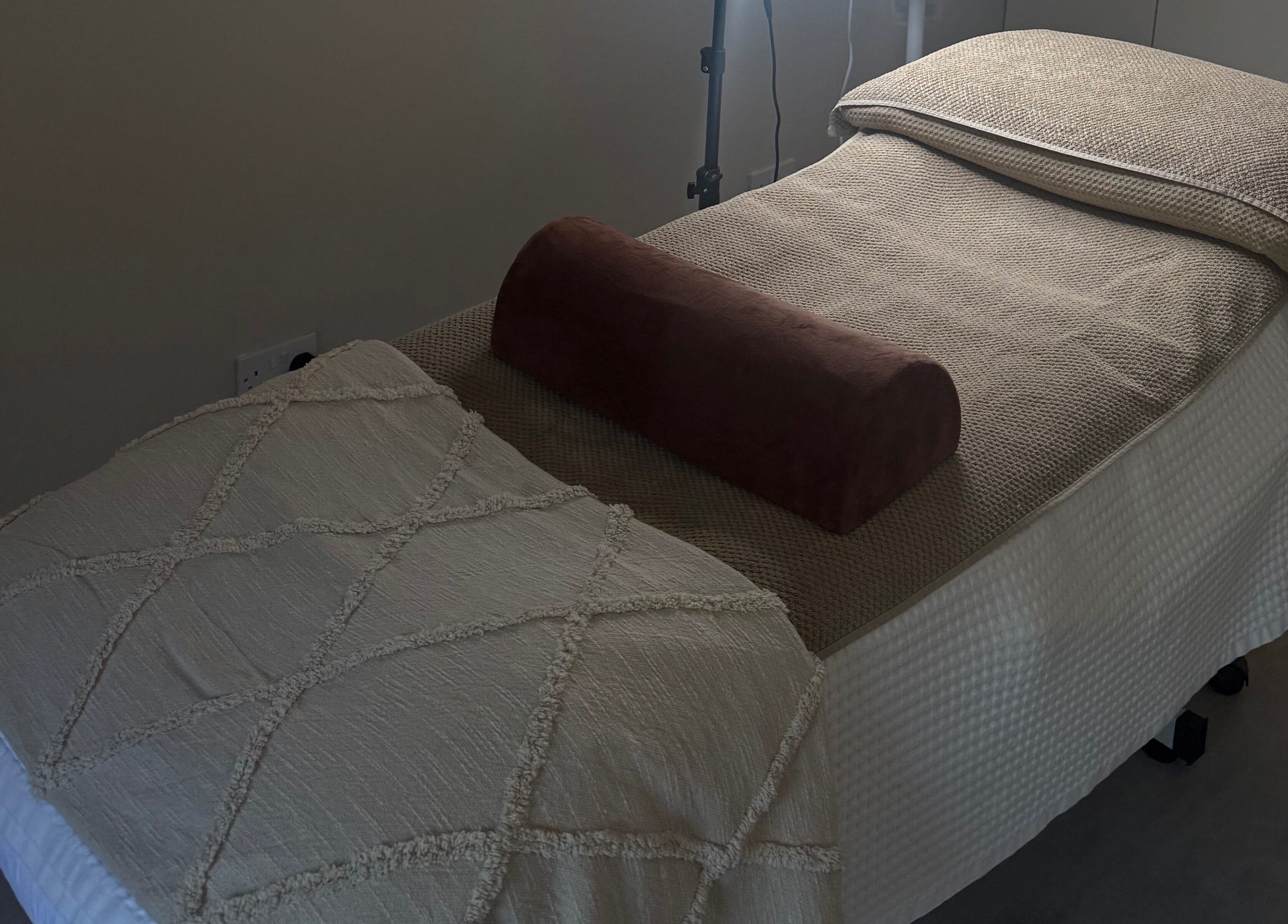 Cozy treatment bed at HYDRASKIN STUDIO, London, England, GB, ready for therapeutic bliss.