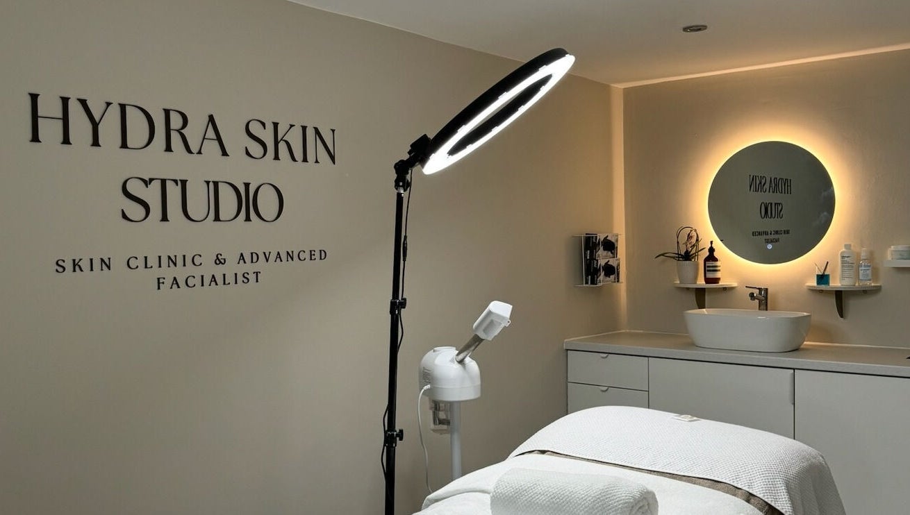 Relaxing interior of HYDRASKIN STUDIO in London, England, GB, showcasing treatment area with elegant lighting.