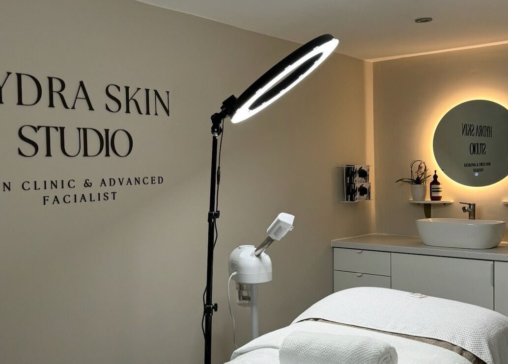 Relaxing interior of HYDRASKIN STUDIO in London, England, GB, showcasing treatment area with elegant lighting.