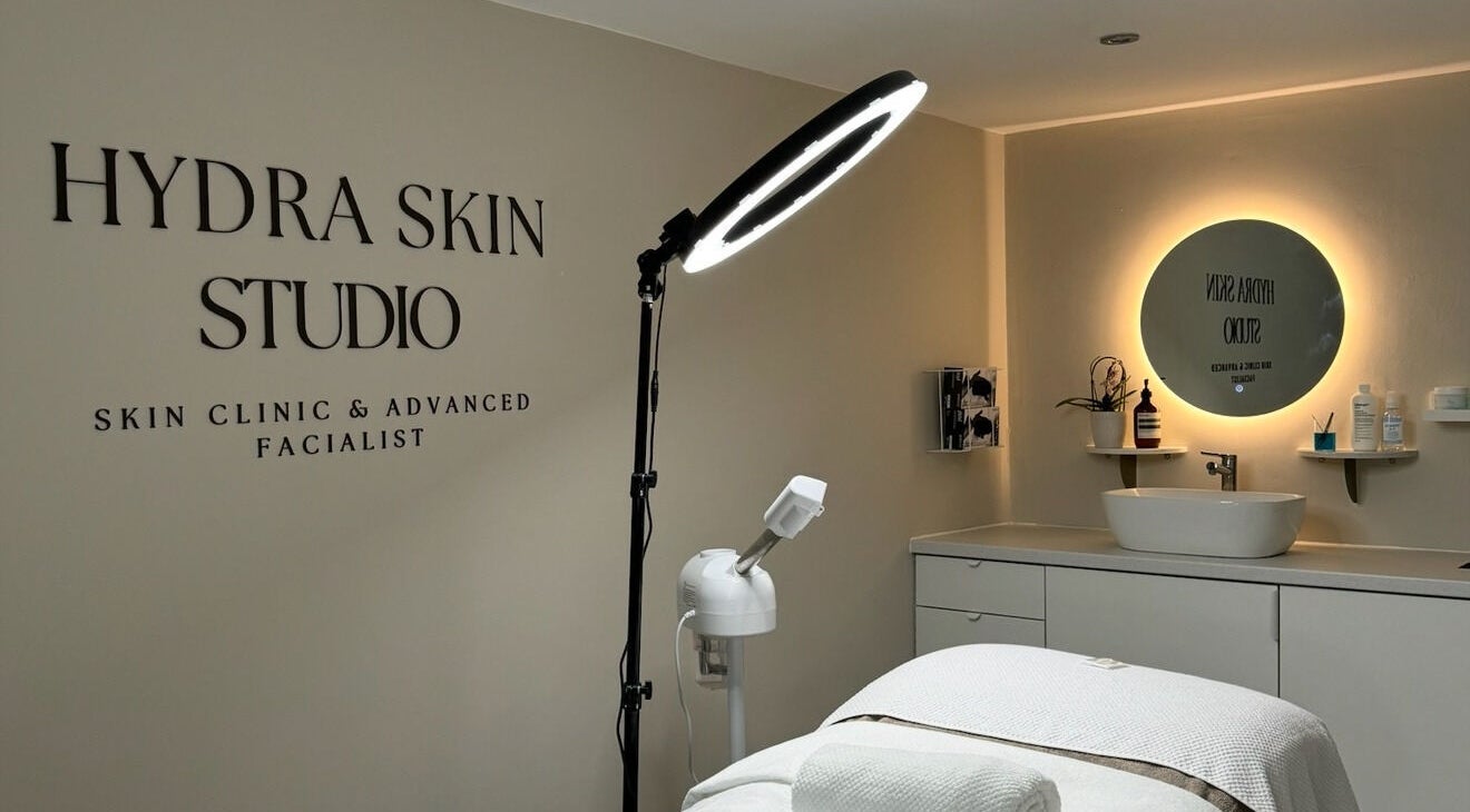 Relaxing interior of HYDRASKIN STUDIO in London, England, GB, showcasing treatment area with elegant lighting.
