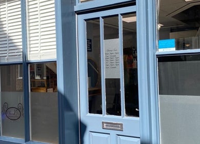 Entrance of Sarah J’s Hair Studio in Pocklington, England, GB, showcasing its elegant blue facade.