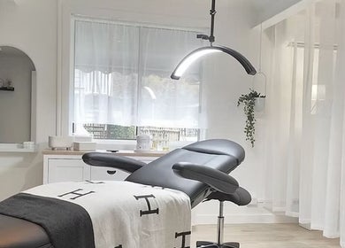 Relaxing treatment room at SHÈ - Skin House Eudlo, Eudlo, Queensland, AU, featuring modern furnishings.