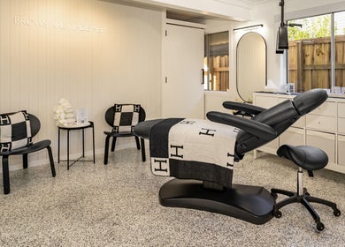 Elegant treatment room at SHÈ - Skin House Eudlo in Eudlo, Queensland, AU featuring modern decor and a reclining chair.