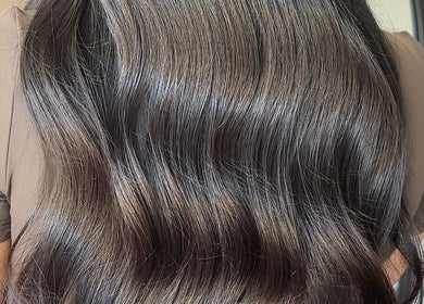 Shiny, wavy brown hair styled at Mirahbell Hair Studio, Bristol, England, GB.