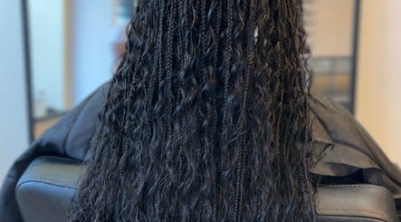 Intricate braided hairstyle at Mirahbell Hair Studio, Bristol, England, GB showcasing expert styling.