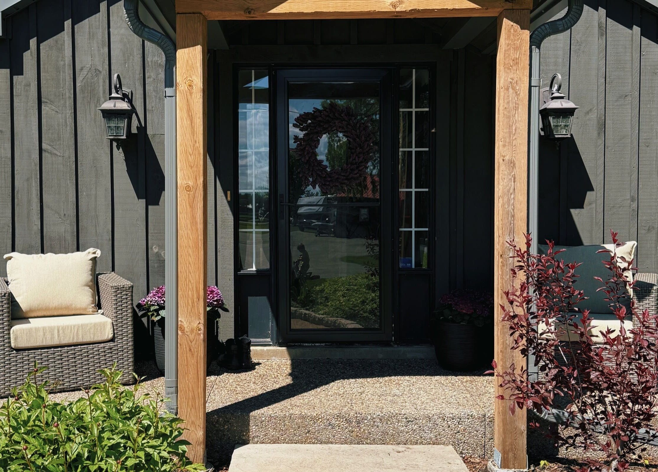 Charming entrance at Rhythm & Roots, Ayr, Ontario, CA with stylish seating and natural decor.
