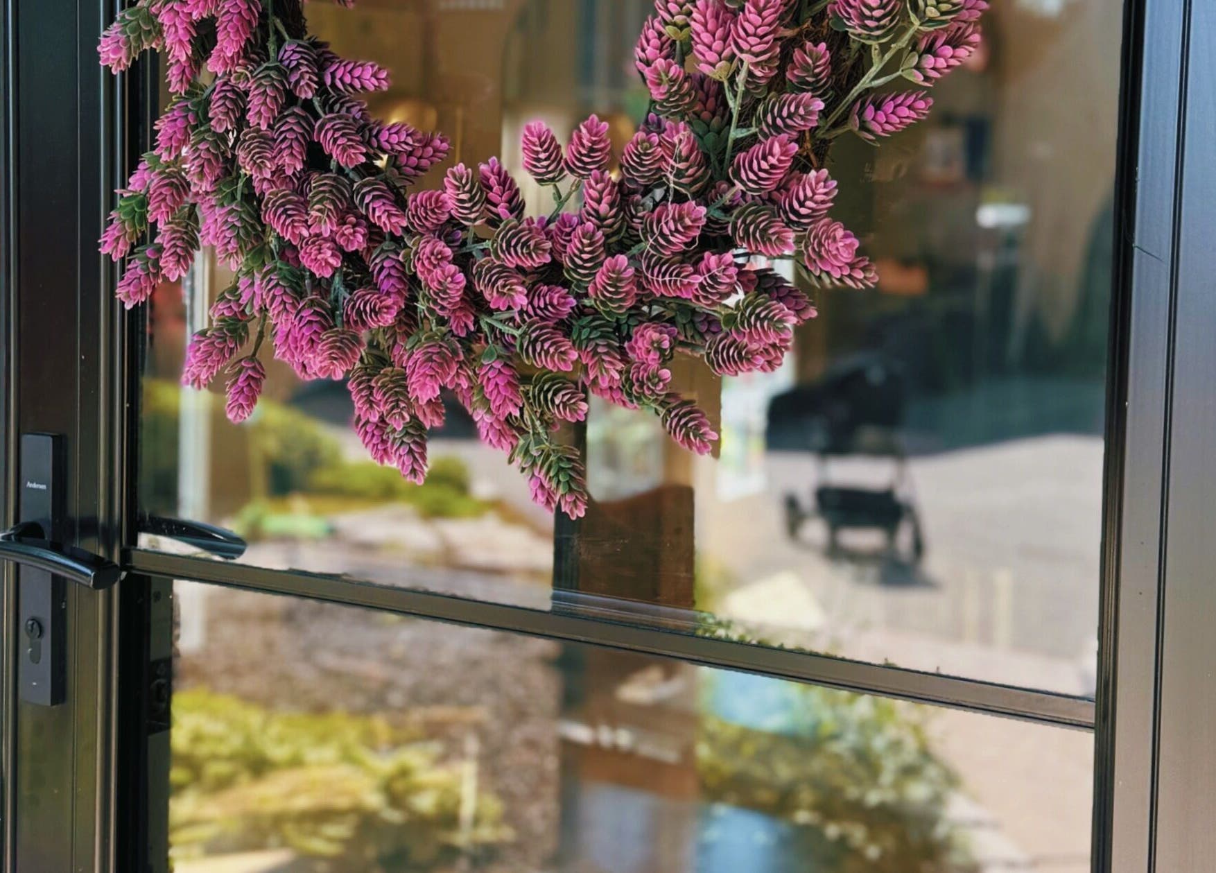 Beautiful pink wreath decorating the entrance of Rhythm & Roots in Ayr, Ontario, CA.
