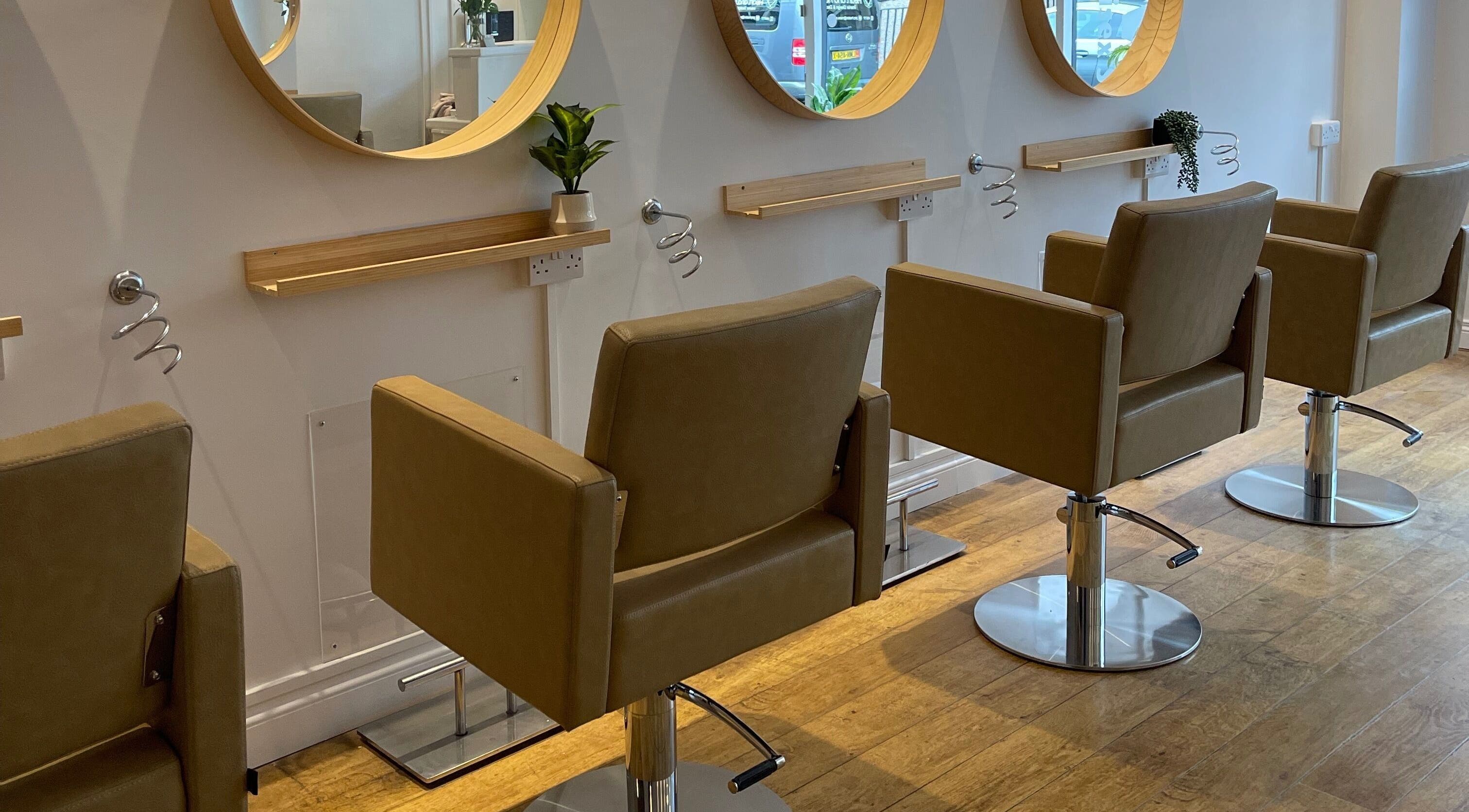 Modern salon chairs at Diva Hair Salon, Douglas, Douglas, IM, with stylish mirrors.