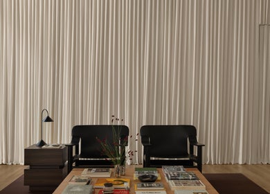 Chic waiting area at Studio Julie Lemke with black chairs, table, and white curtains in Dubai, Dubai, AE.
