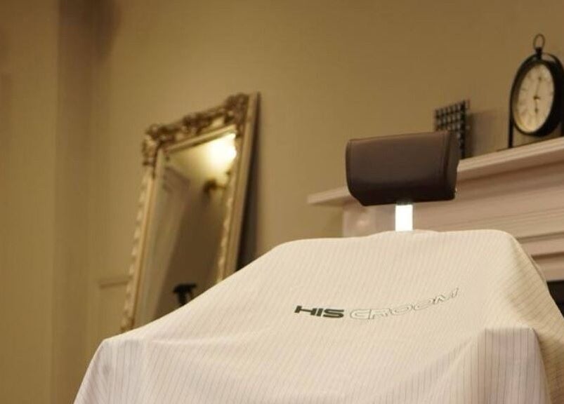 Barber chair at His Grooming in Ayr, Scotland, GB with elegant decor in background.