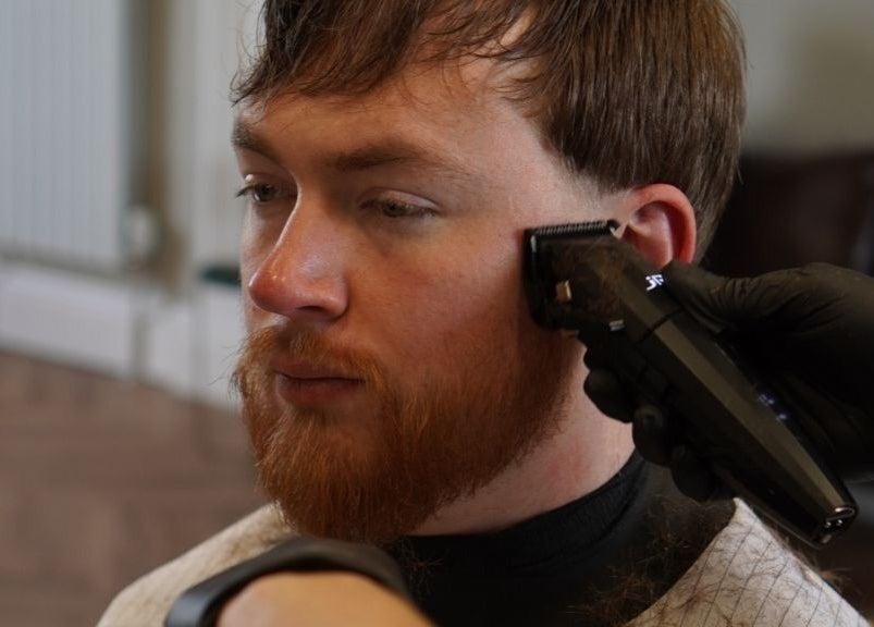 Close-up of man receiving a beard trim at His Grooming in Ayr, Scotland, GB. Featuring precise clipper work.