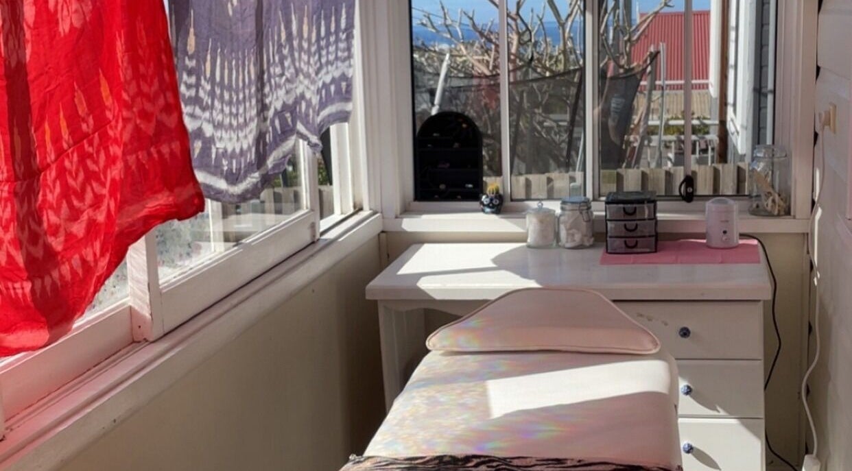 Relaxing spa room at Possession Beauty, Thirroul, New South Wales, AU with ocean view and light-filled space.