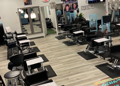 Modern salon interior at Gina African Hair Braiding, Cincinnati, Ohio, US, showcasing stylish seating and decor.