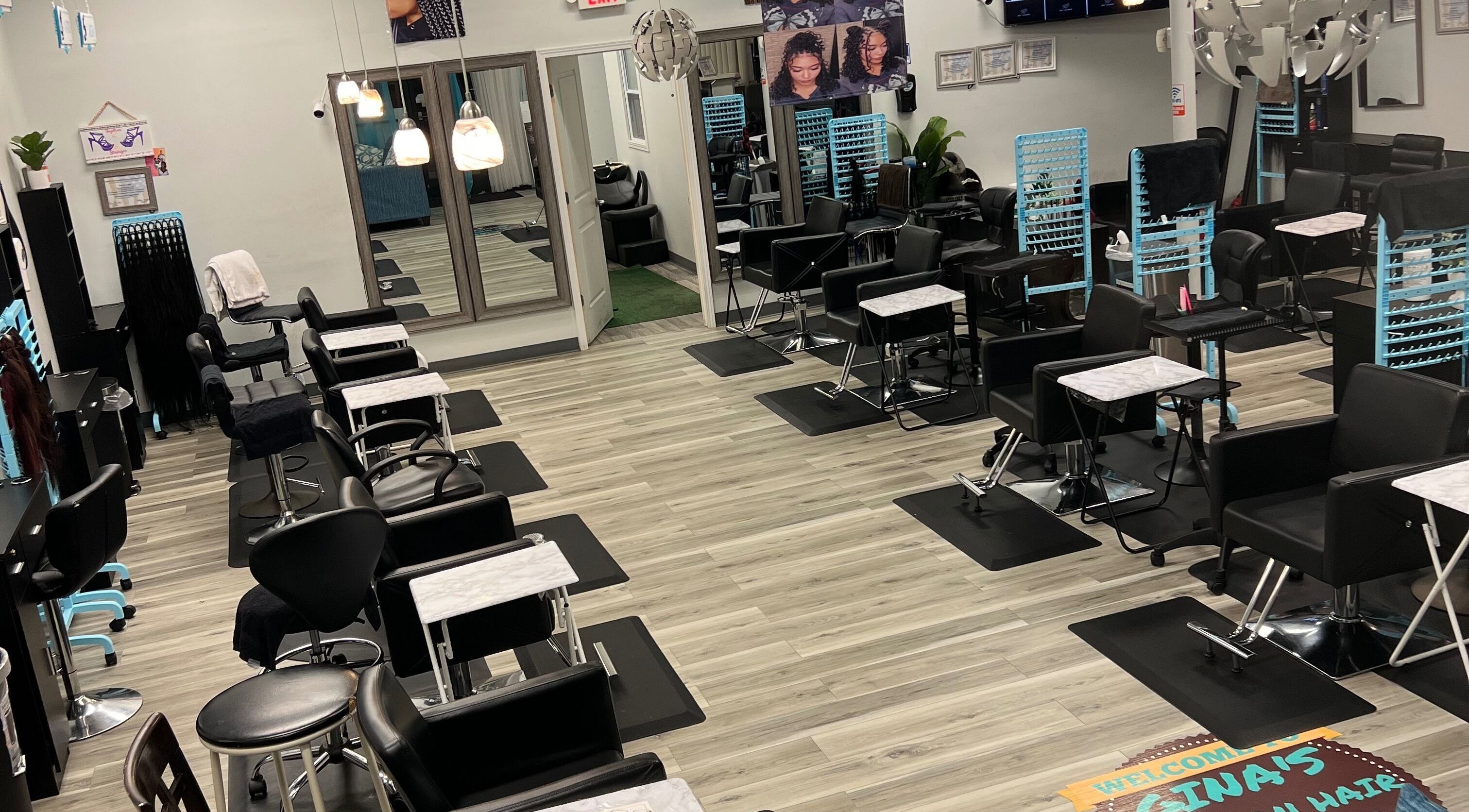 Modern salon interior at Gina African Hair Braiding, Cincinnati, Ohio, US, showcasing stylish seating and decor.