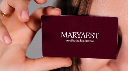 Close-up of MaryAest business card held by a hand in Kelowna, British Columbia, CA.