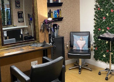 Elegant salon interior at Vibe. Hair by Sharon in Kidderminster, England, GB, showcasing stylish decor and seating.