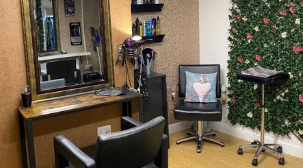 Elegant salon interior at Vibe. Hair by Sharon in Kidderminster, England, GB, showcasing stylish decor and seating.