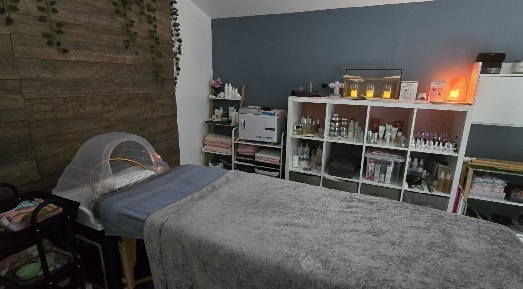 Relaxing treatment room at Loveli in Grangemouth, Scotland, GB, with cozy bed and ambient lighting.