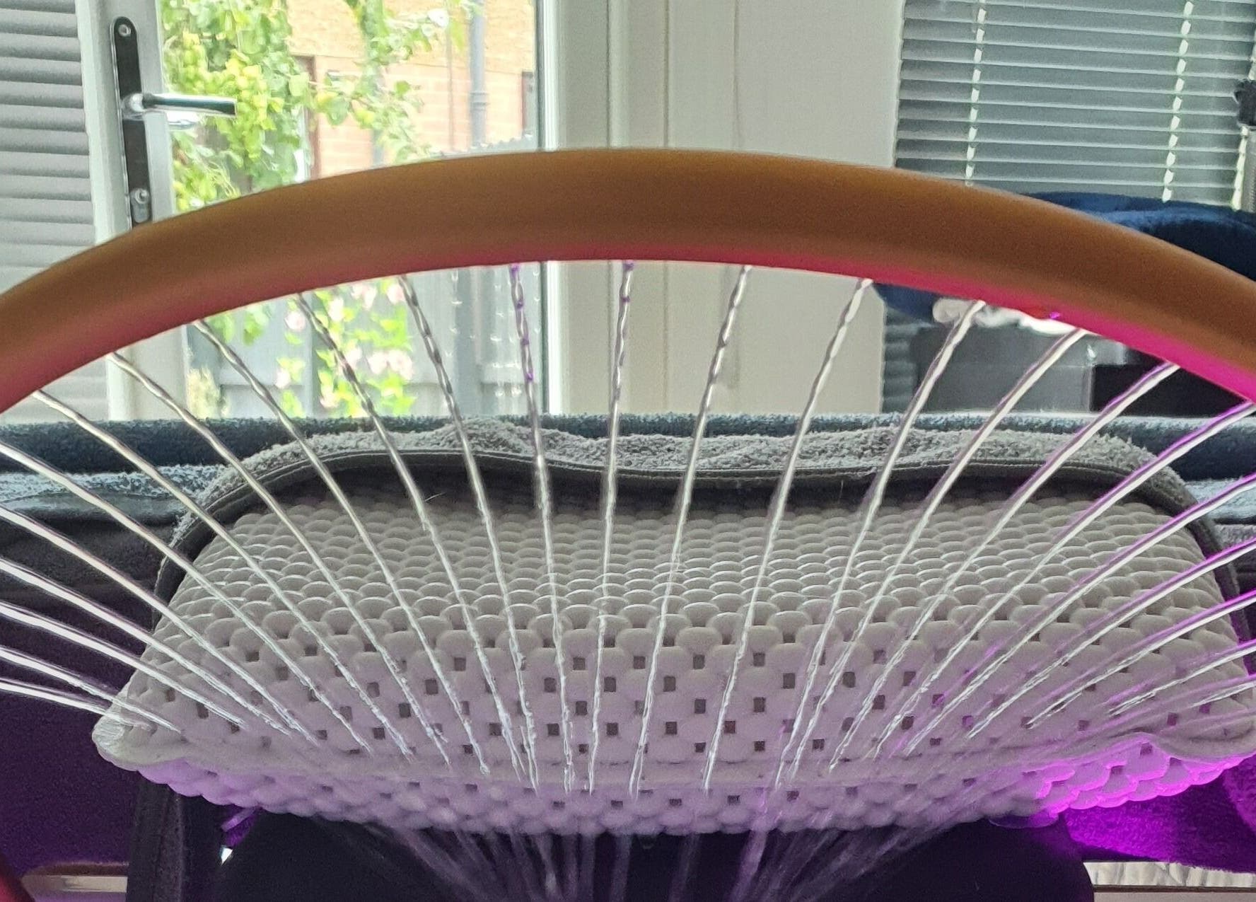 Relaxing lounge chair at Loveli, Grangemouth, Scotland, GB with a modern design and cozy cushion.