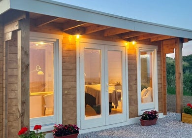 Warmly lit beauty cabin at By Lana Grace in Ludgvan, England, GB, enhancing a serene wellness ambiance.