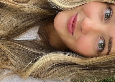 Close-up of smiling woman with long blonde hair at By Lana Grace, Ludgvan, England, GB.