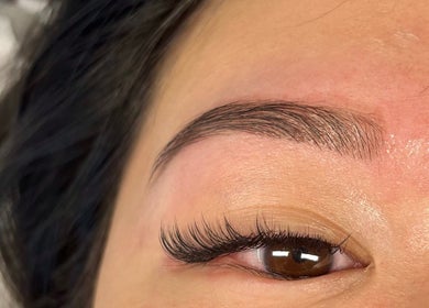 Close-up of expertly groomed eyebrow and long lashes at By Lana Grace, Ludgvan, England, GB.